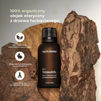 Butelka olejku z drzewa herbacianego mybiochoice na tle kory — 100% składników pochodzenia naturalnego