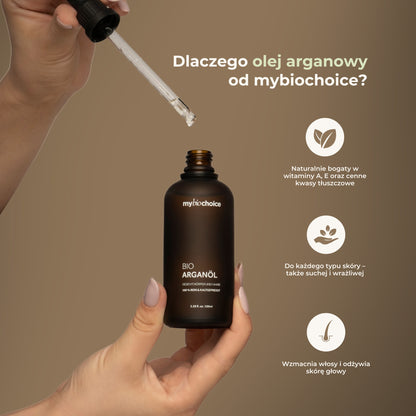 Ręka z pipetą i butelka olejku arganowego mybiochoice – właściwości odżywcze i pielęgnacyjne.